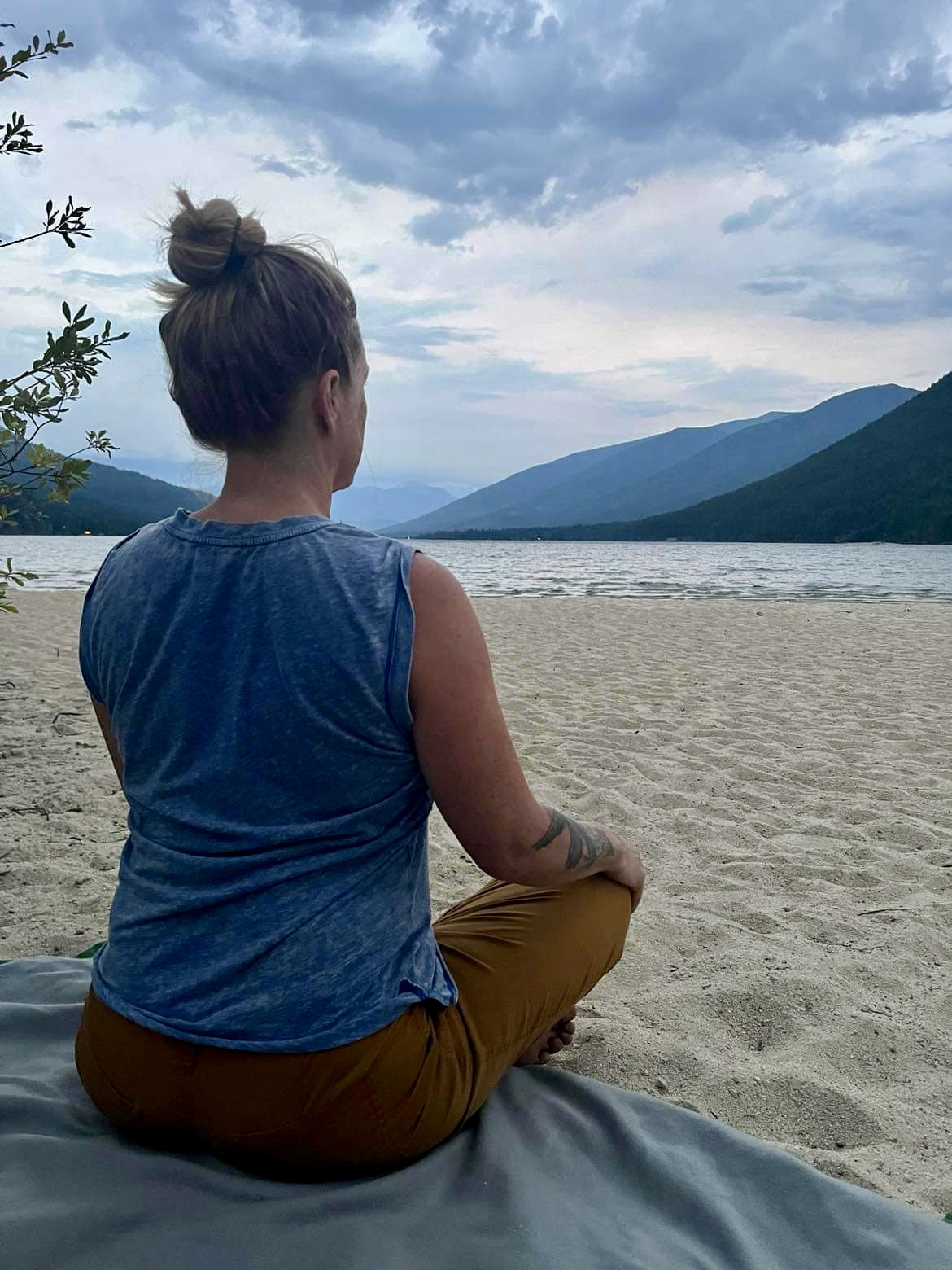 Meditating in front of glacial lake